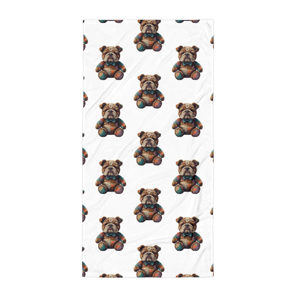 A rectangular white towel or beach towel featuring a repeating pattern of brown bulldog teddy bears, shown flat against a white background.