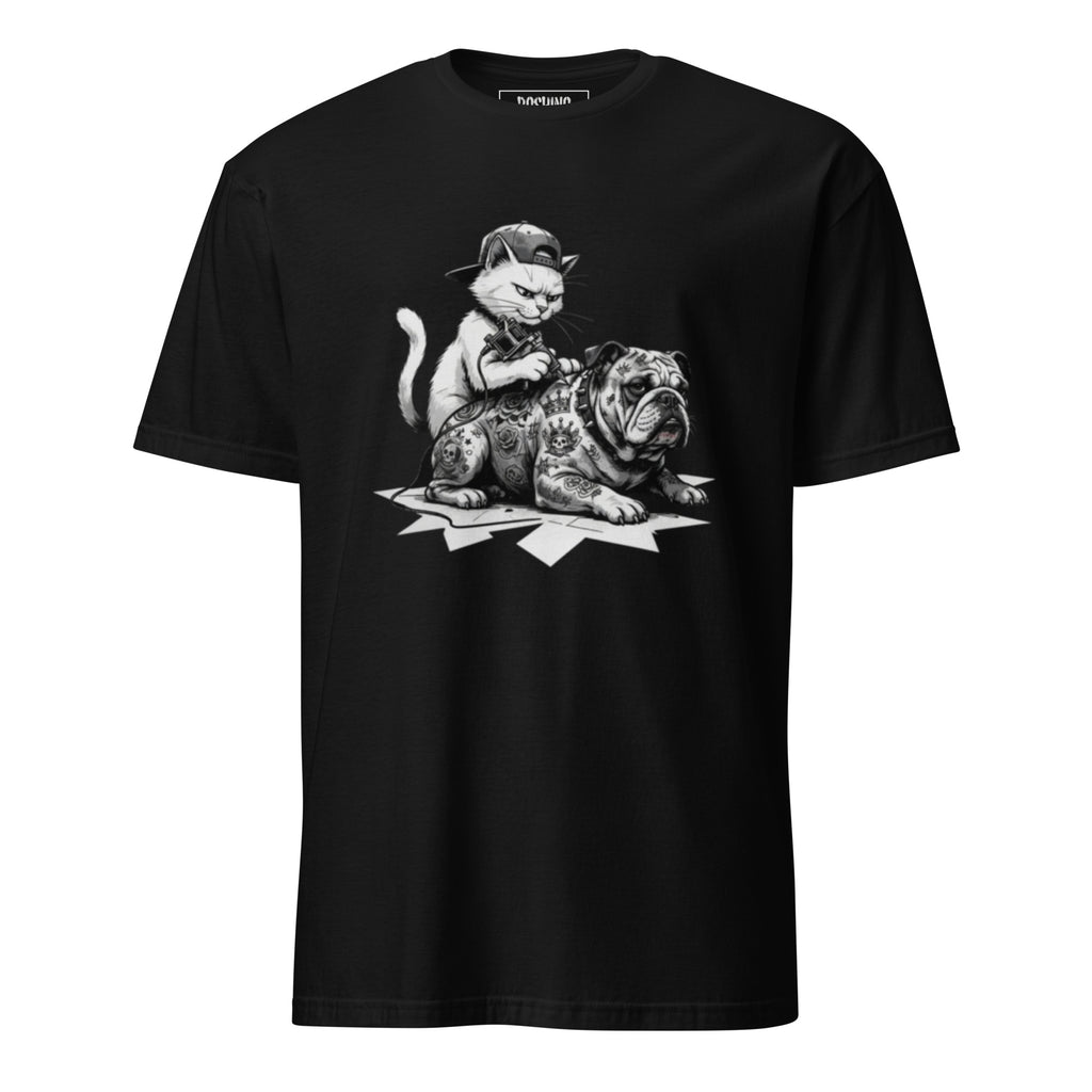 A black short-sleeve crewneck t-shirt featuring a detailed black and white graphic print of a kitten sitting on top of a tattooed bulldog, displayed against a solid white background.