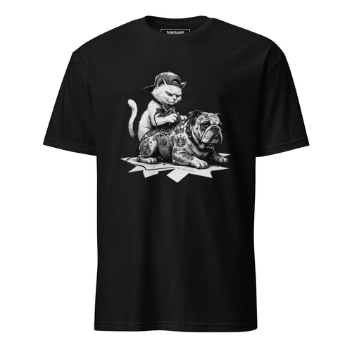 A black short-sleeve crewneck t-shirt featuring a detailed black and white graphic print of a kitten sitting on top of a tattooed bulldog, displayed against a solid white background.