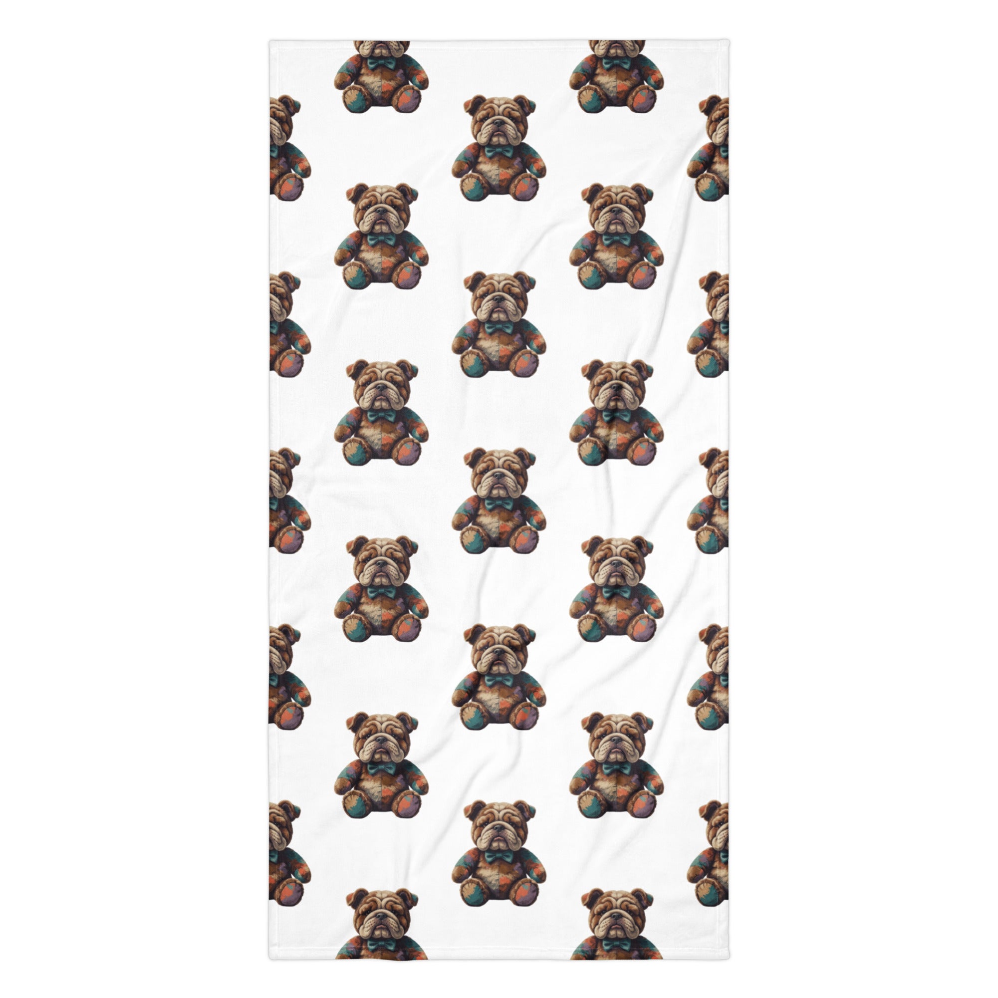 A white rectangular towel featuring a repeating pattern of small brown teddy bears with colorful accents, shown flat against a white background.